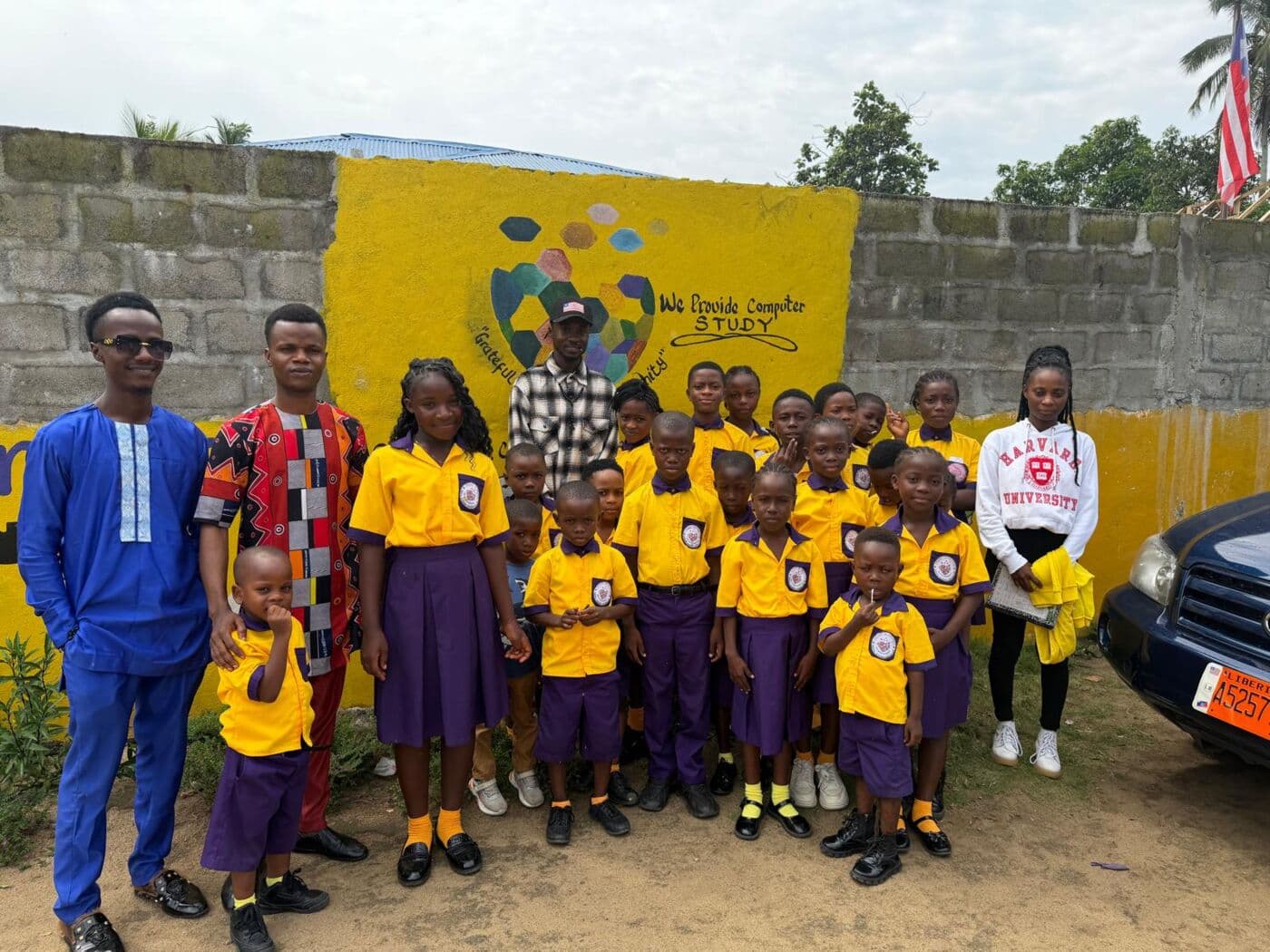 Students from Heart In Heaven Digital Academy outside their school in Liberia